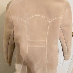 A tan, fur-lined coat,
